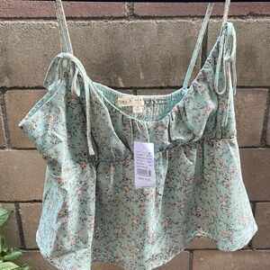 Brand: L.A. Hearts Color: aqua with floral detailing Size: M